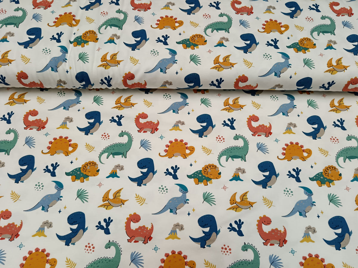 Niedlicher Baumwoll Jersey für Kinder und Babys in weiß mit bunten Dinos - Modemeter Stoffmarkt Trier   modemeter.de