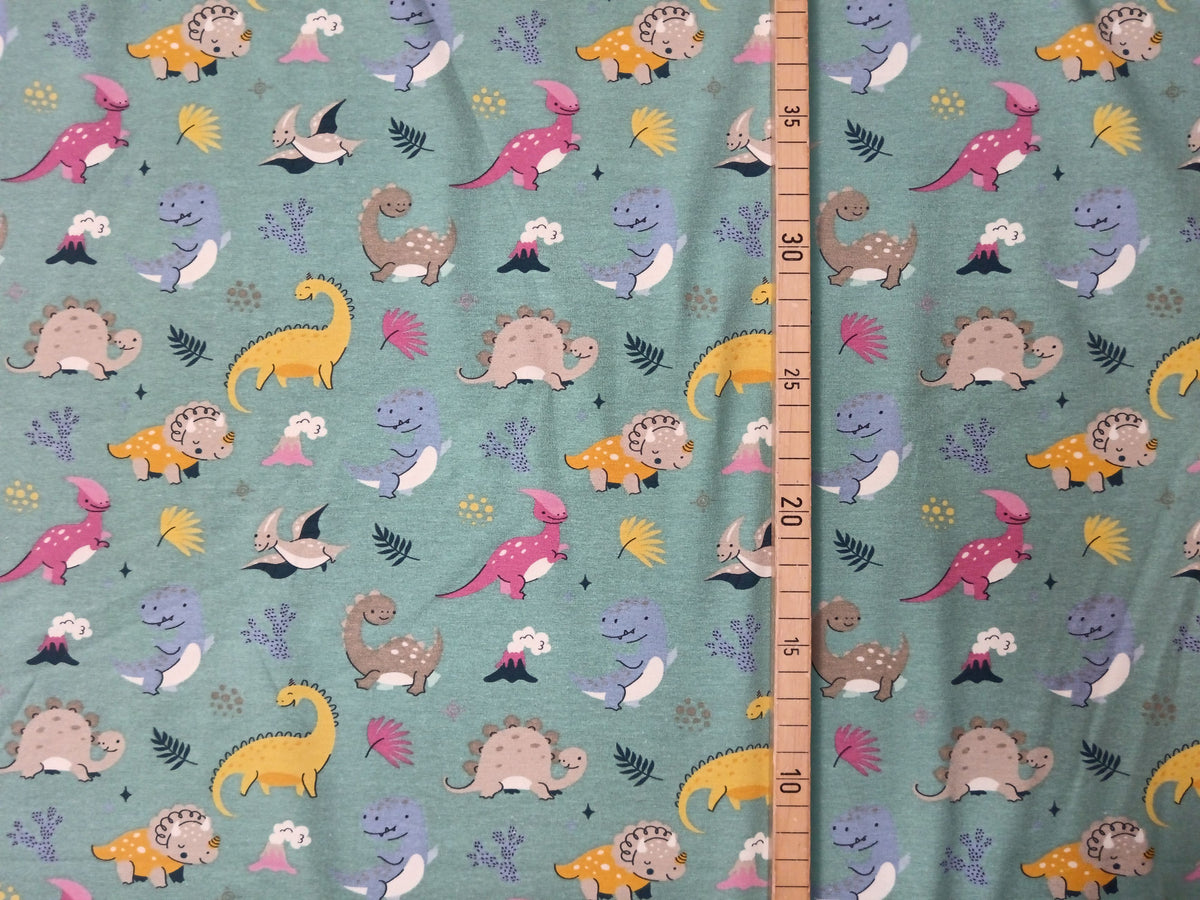 So niedlich - Baumwoll Jersey für Kinder in seegrün mit bunten Dinos - Modemeter Stoffmarkt
