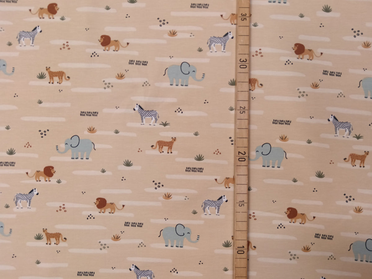 Niedlicher Baumwoll Jersey für Kinder in beige mit Zootieren - Modemeter Stoffmarkt