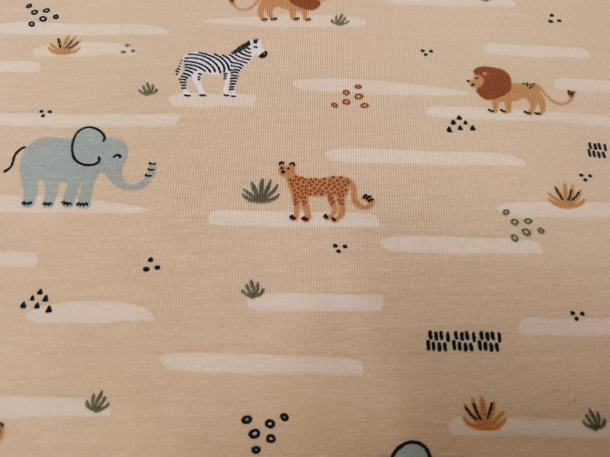 Niedlicher Baumwoll Jersey für Kinder in beige mit Zootieren - Modemeter Stoffmarkt