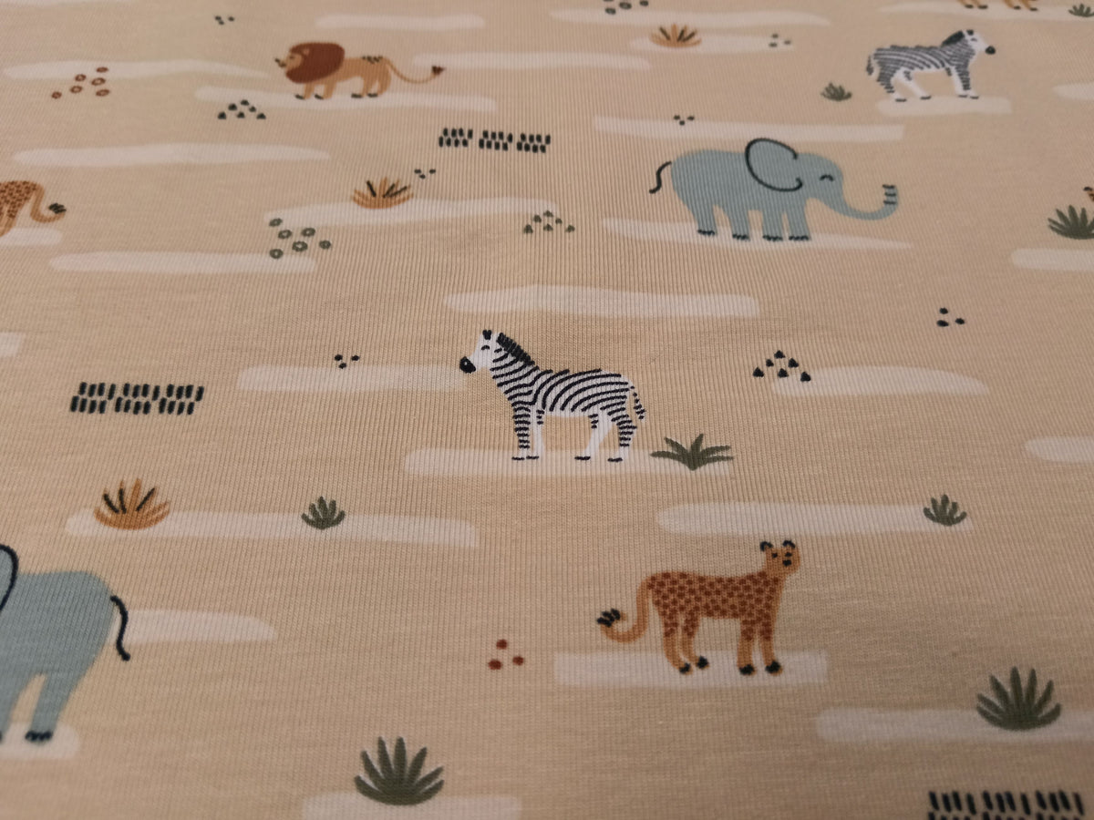 Niedlicher Baumwoll Jersey für Kinder in beige mit Zootieren - Modemeter Stoffmarkt