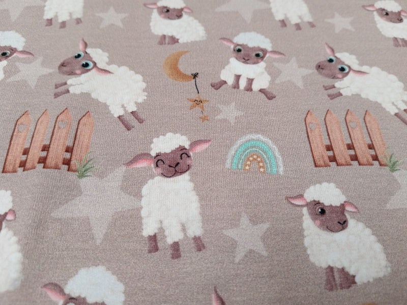 Baumwolljersey in taupe mit niedlichen Schafen - Modemeter Stoffmarkt