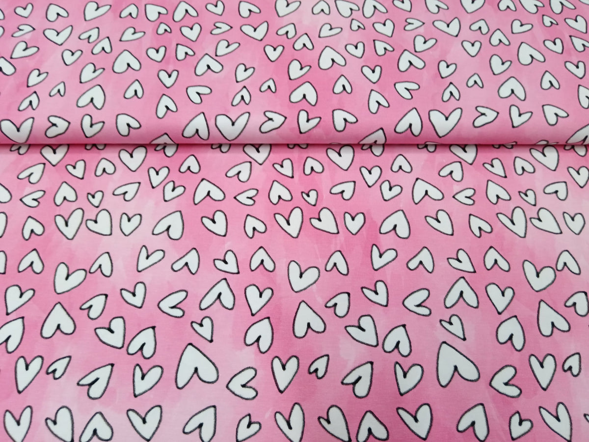 Baumwolljersey in rosa-pink mit weißen Herzen - Modemeter Stoffmarkt