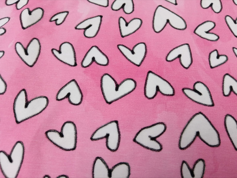 Baumwolljersey in rosa-pink mit weißen Herzen - Modemeter Stoffmarkt