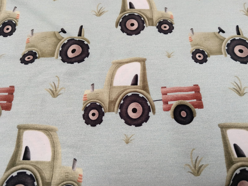 Bauernhof Jersey in hellblau mit verschiedenen Traktoren - Modemeter Stoffmarkt