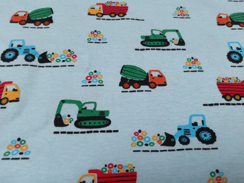 Baumwolljersey in hellblau mit Baggern, Traktoren, Lkw's - Modemeter Stoffmarkt