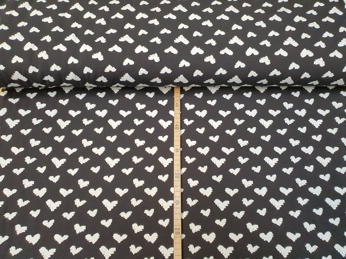 Baumwoll Jersey aus Bio Baumwolle GOTS in schwarz mit weißen Herzen - Modemeter Stoffmarkt Trier   modemeter.de