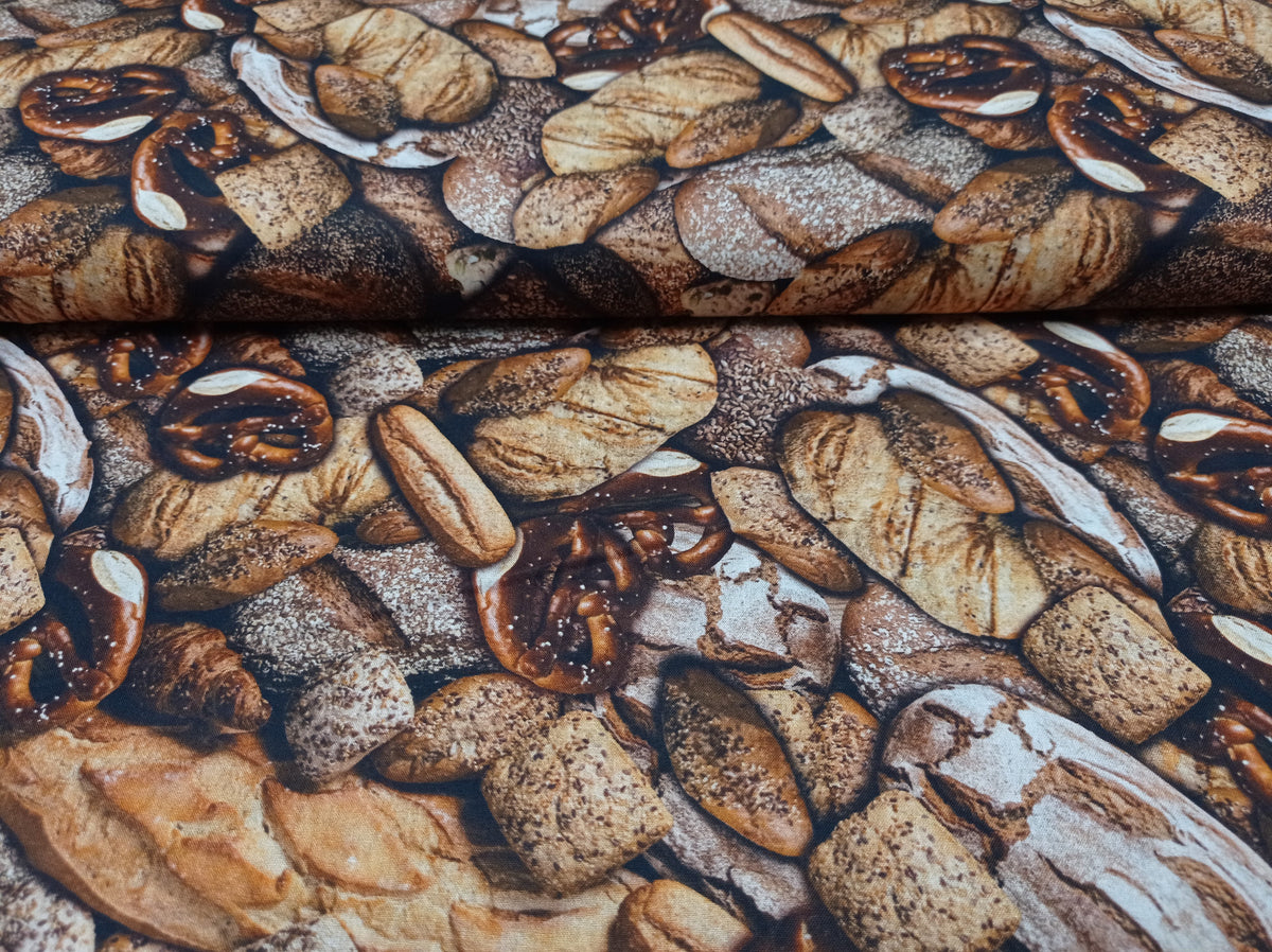 Baumwollstoff (Webware) in Brauntönen mit Brot Motiven - Modemeter Stoffmarkt Trier   modemeter.de