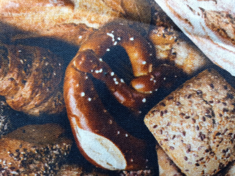 Baumwollstoff (Webware) in Brauntönen mit Brot Motiven - Modemeter Stoffmarkt Trier   modemeter.de