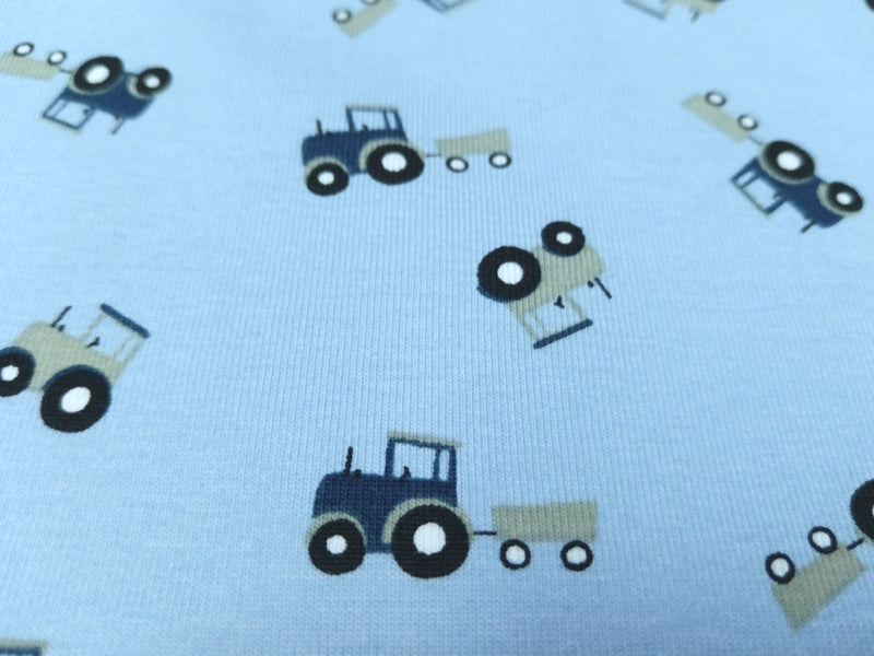 Baumwoll Jersey für Kinder in babyblau mit kleinen Traktoren - Modemeter Stoffmarkt Trier   modemeter.de