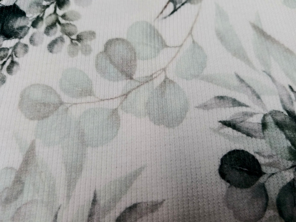 Besonderer Ripp Jersey in weiß mit grün-blauem Eucalyptus Design - Modemeter Stoffmarkt
