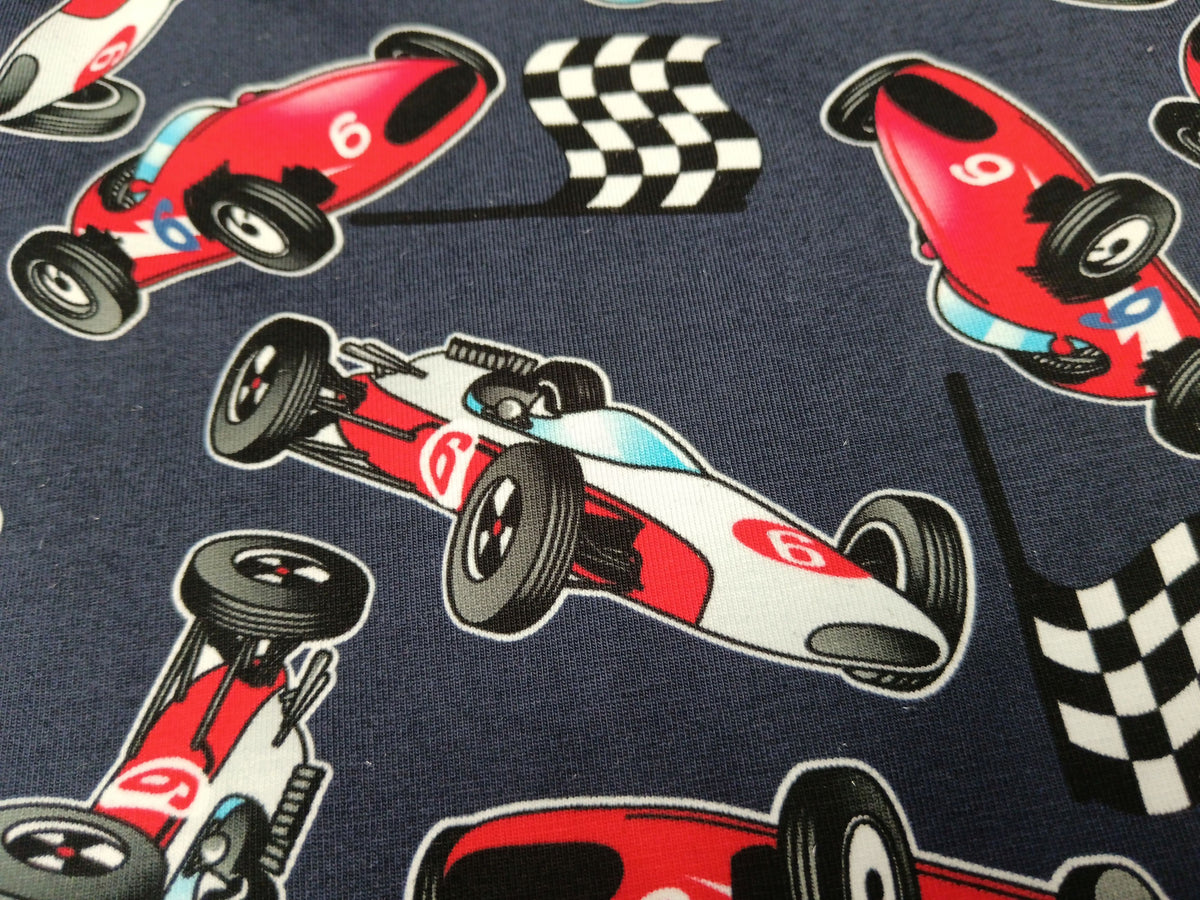 Baumwolljersey in dunkelblau mit Rennwagen Motiven - digital bedruckt