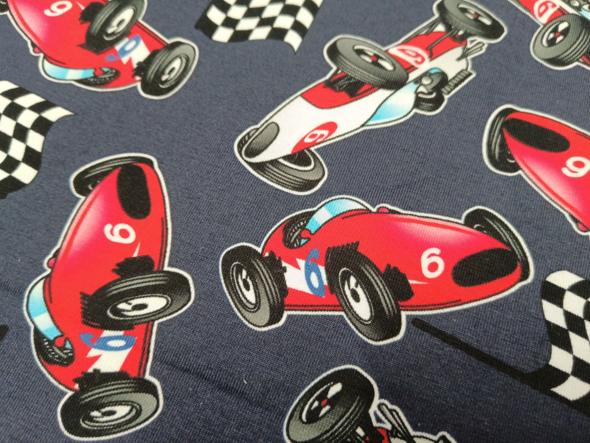 Baumwolljersey in dunkelblau mit Rennwagen Motiven - digital bedruckt